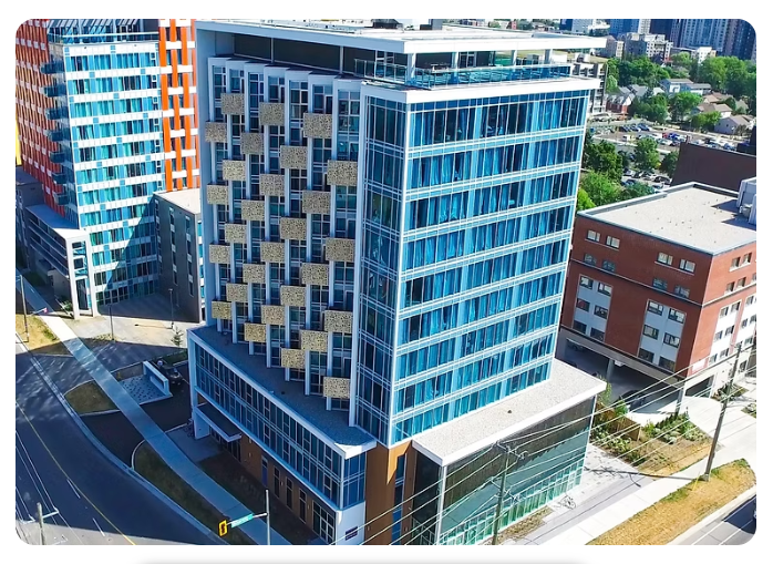Modern glass high-rise apartment tower at 222 Albert Street in Waterloo